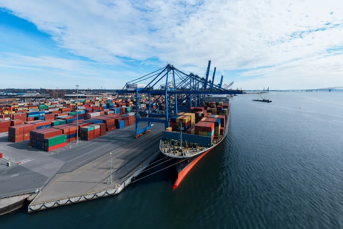 Container ship at a port with cranes